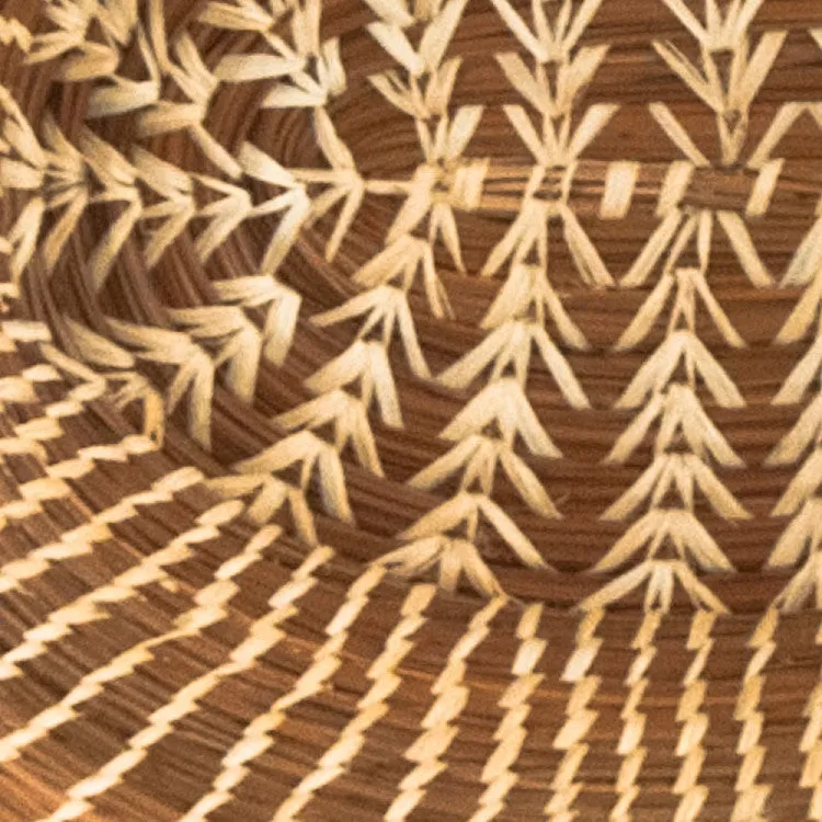 Oval pine needle basket with raffia